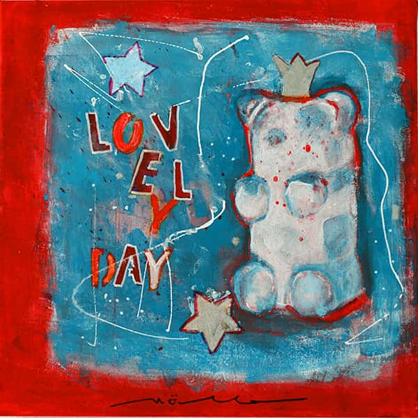Ein Gummibär vor einem blau roten Hintergrund mit der Aufschrift Lovely Day.